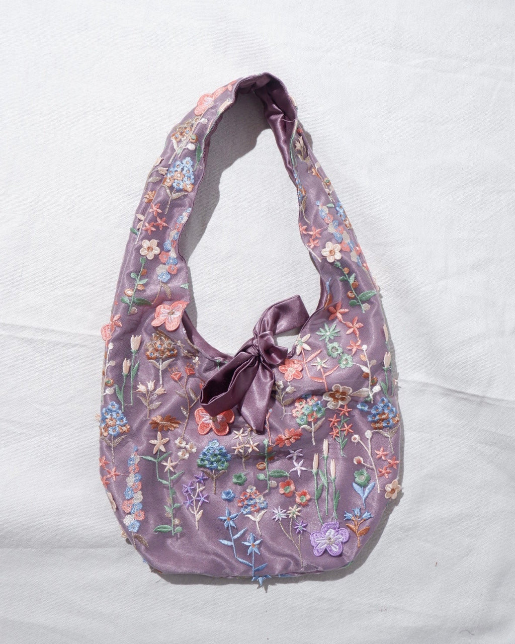 Floral patterned handbag on a white background